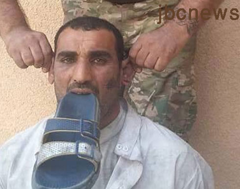 صورة : الحشد الشيعي يجبر هذا السني على وضع الحذاء بفمه صورة : الحشد الشيعي يجبر هذا السني على وضع الحذاء بفمه