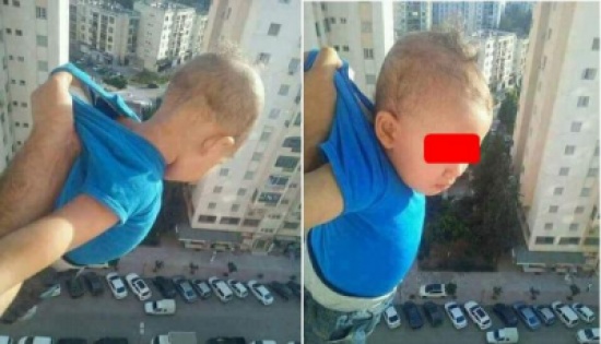 شاهد: شخص يغامر بحياة طفل من أجل صور تحبس الأنفاس شاهد: شخص يغامر بحياة طفل من أجل صور تحبس الأنفاس