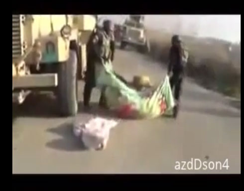 بالفيديو : جيش المالكي يسحب قتلاه في محافظة الانبار العراقية