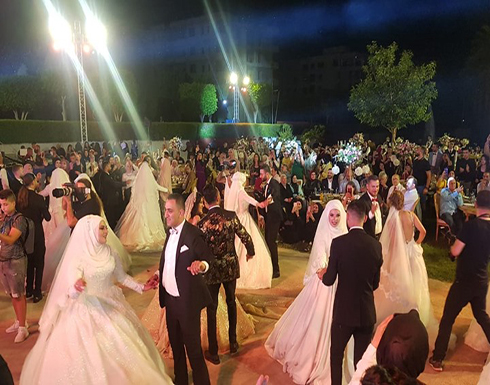 زفاف جماعي لـ15 عريسا يتحدى الأزمة الاقتصادية بلبنان (صور) زفاف جماعي لـ15 عريسا يتحدى الأزمة الاقتصادية بلبنان (صور)
