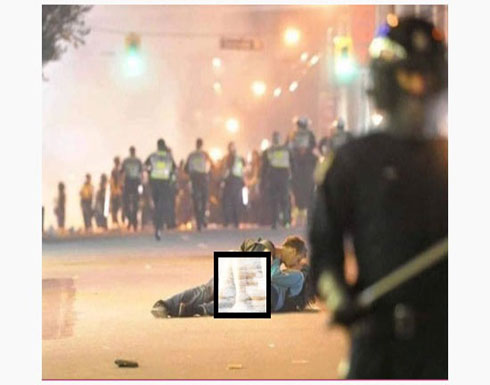 حقيقة صورة "قبلة عاشقين" وسط الاحتجاجات في باريس حقيقة صورة "قبلة عاشقين" وسط الاحتجاجات في باريس
