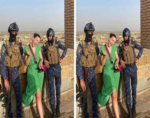 شاهد : صورة سائحة تتوسط جنود عراقيين تثير الجدل شاهد : صورة سائحة تتوسط جنود عراقيين تثير الجدل